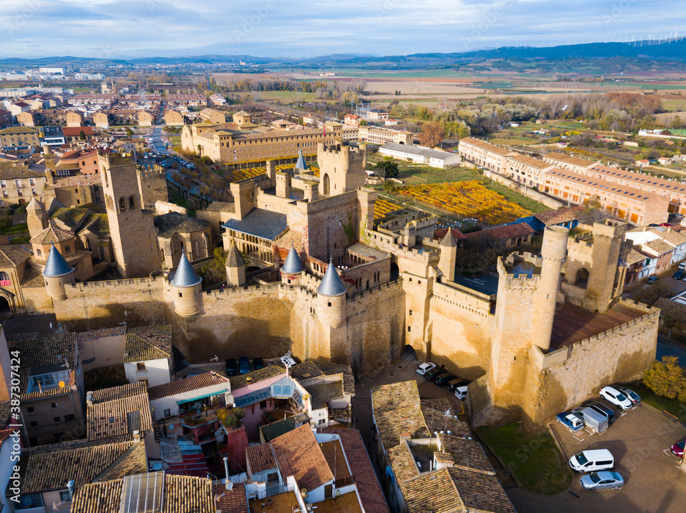 Picturesque autumn landscape of Olite with imposing medieval Palace of Kings of Navarre, Spain