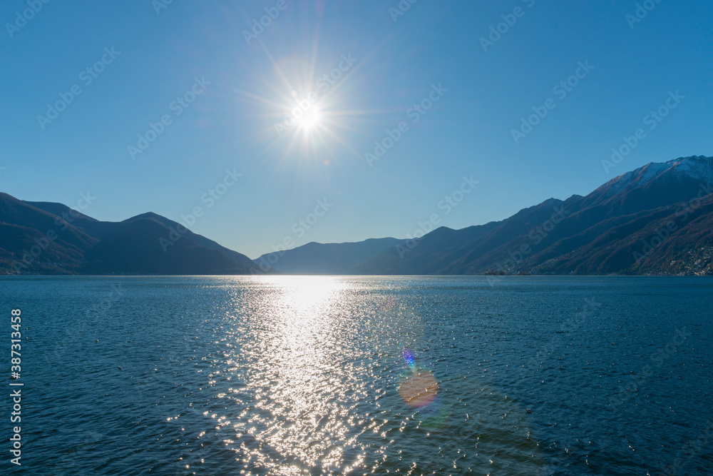 custom made wallpaper toronto digitalAlpine Lake Maggiore with Mountain and Sunlight in Ascona, Ticino in Switzerland.
