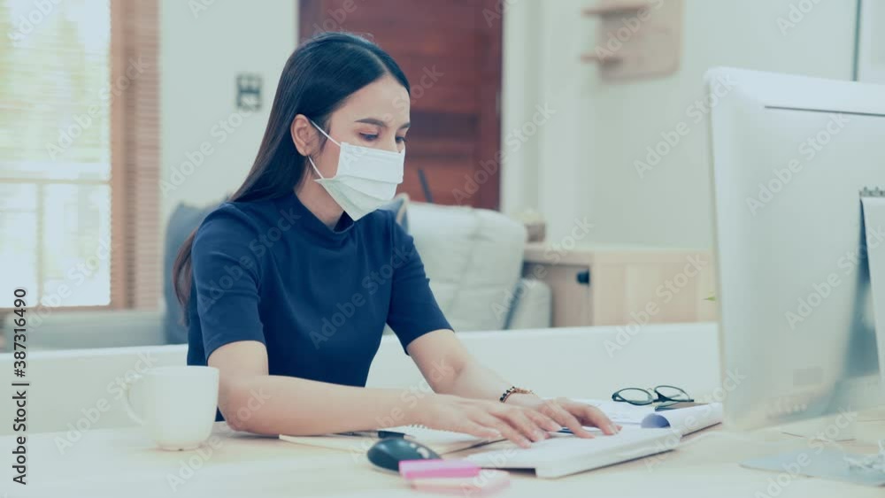 Young business woman wears face mask using computer coughing at home office. Ill female worker working distantly self-isolating having coronavirus flu infection symptom concept.
Young business woman wears face mask using computer coughing at home office. Ill female worker working distantly self-isolating having coronavirus flu infection symptom concept.