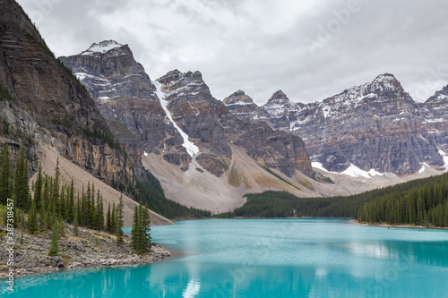 Beautiful turquoise water surround with taiga forest and rocky mountain in summer morning at Moraine Lake Alberta Canada