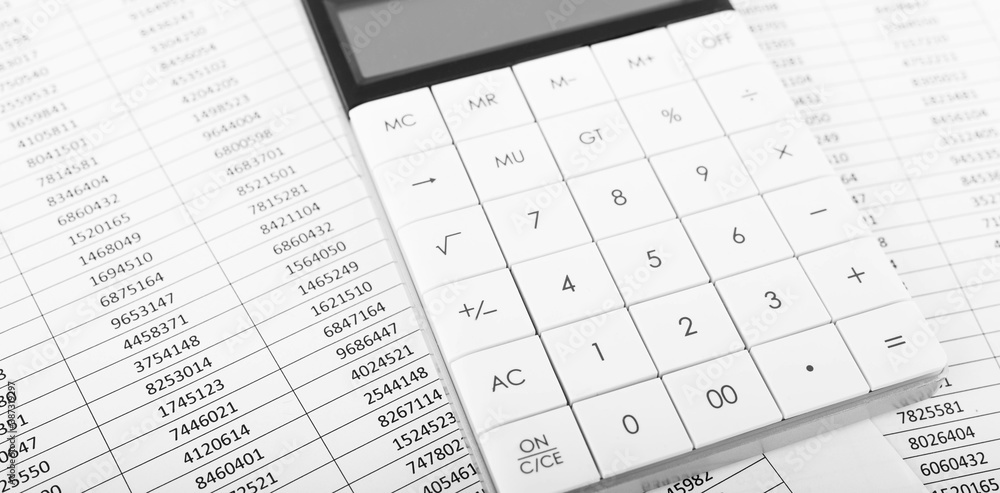 Calculator with Financial accounting graphs. Finance, business and accounting concept. Calculator with Financial accounting graphs. Finance, business and accounting concept.