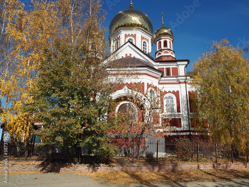 Kazan Orthodox Church in the ancient city of Petrovsk in Russia under the clear blue sky.Autumn view. photo