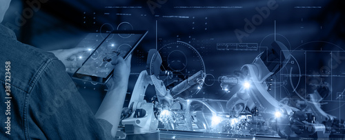 Futuristic technology trend concept of smart industry 4.0 engineer use artificial intelligence robotic automation machine in factory Connecting data network software to monitoring, operating process