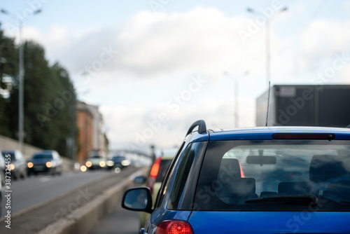 Traffic in the city-view of the blue car from behind © kulkann