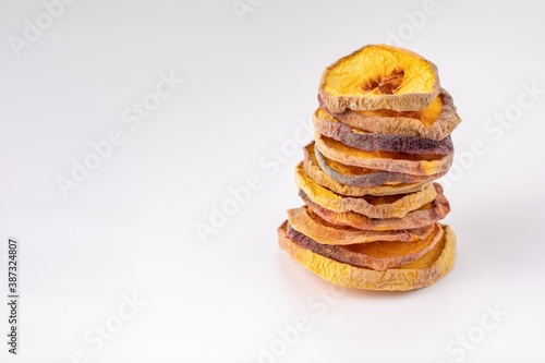 slices of dried peach on a white background. dried fruits. eco. macro.