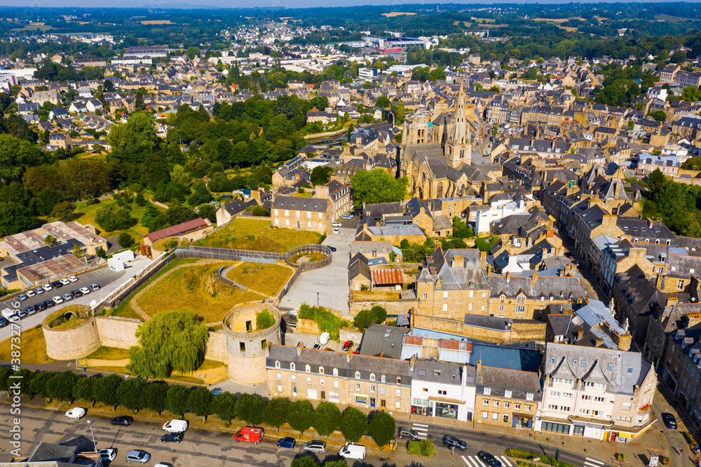 General view of French town of Guingamp in summer looking out over medieval Basilica and walls of ancient fortified chateau, Brittany..