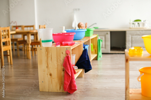 Children's montessori center, equipment and toys in the montessori center, wooden toys and development aids in the children's center background