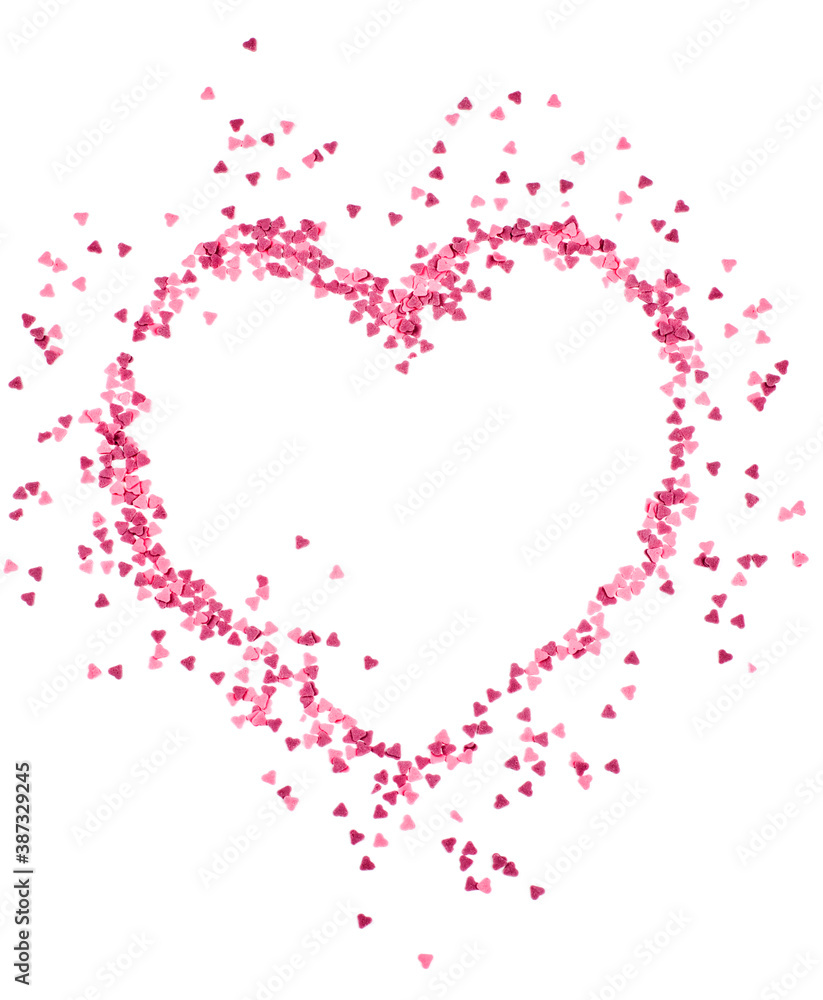 Scattered candy hearts shaped as a heart isolated on white background