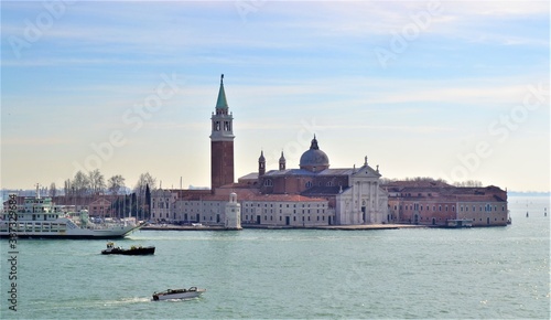 San Giorgio Maggiore (church), Venice Italy. San Giorgio in Venice (Venedig) during sunny day and turquoise sea. White and blue sky.