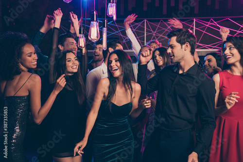 Canvas Print Photo portrait of excited people dancing together at fancy nightclub feeling goo