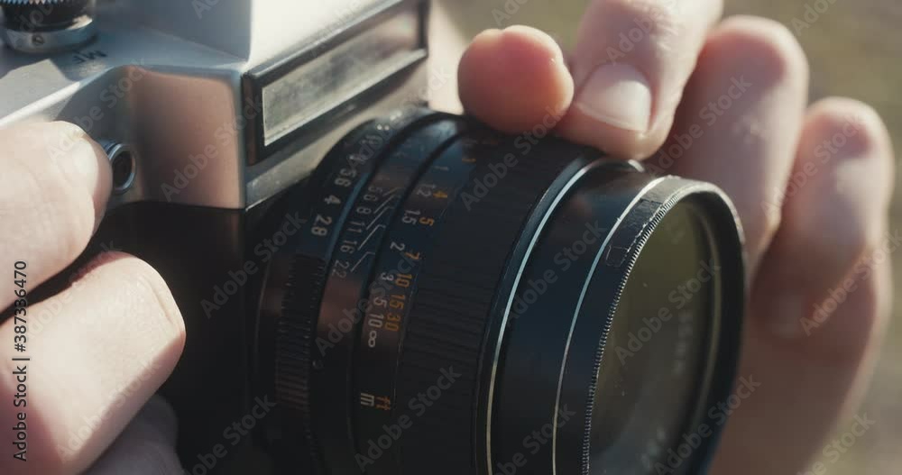 Photographer focus manual lens hand press analog photo camera trigger