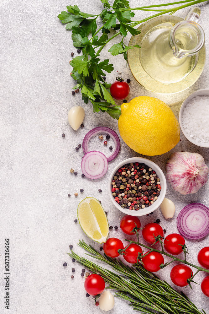 Herbs and condiments on light stone background. Herbs and condiments on light stone background.