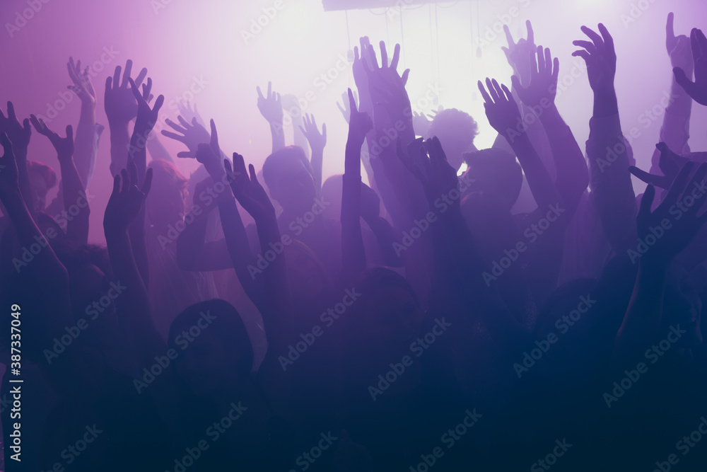 Photo of big group careless funny people raise hands rejoice wear stylish trendy outfit modern club indoors