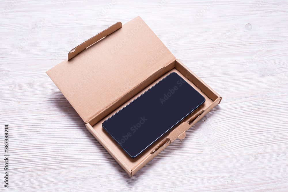 Brown flat cardboard box for cellphone, smartphone case packaging. Brown flat cardboard box for cellphone, smartphone case packaging.
