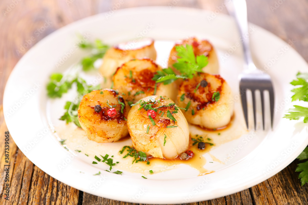 seared scallop with herb in plate seared scallop with herb in plate