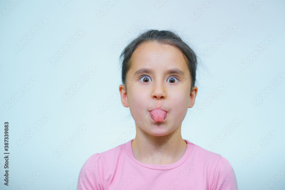 portrait of a girl who makes grimaces. portrait of a girl who makes grimaces.