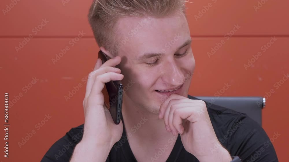 Closeup smiling man talking mobile phone in office. Close up of cheerful businessman having phone call at workplace in slow motion. Portrait of happy business man calling phone indoor. Closeup smiling man talking mobile phone in office. Close up of cheerful businessman having phone call at workplace in slow motion. Portrait of happy business man calling phone indoor.