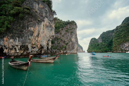 Traveling by Thailand. Vacation on island. Beautiful landscape with sea, boat and rocks.