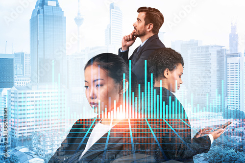 Photography Group of business colleagues in suits as a part of multinational corporate team working on forecasting trading corporate strategy at fund