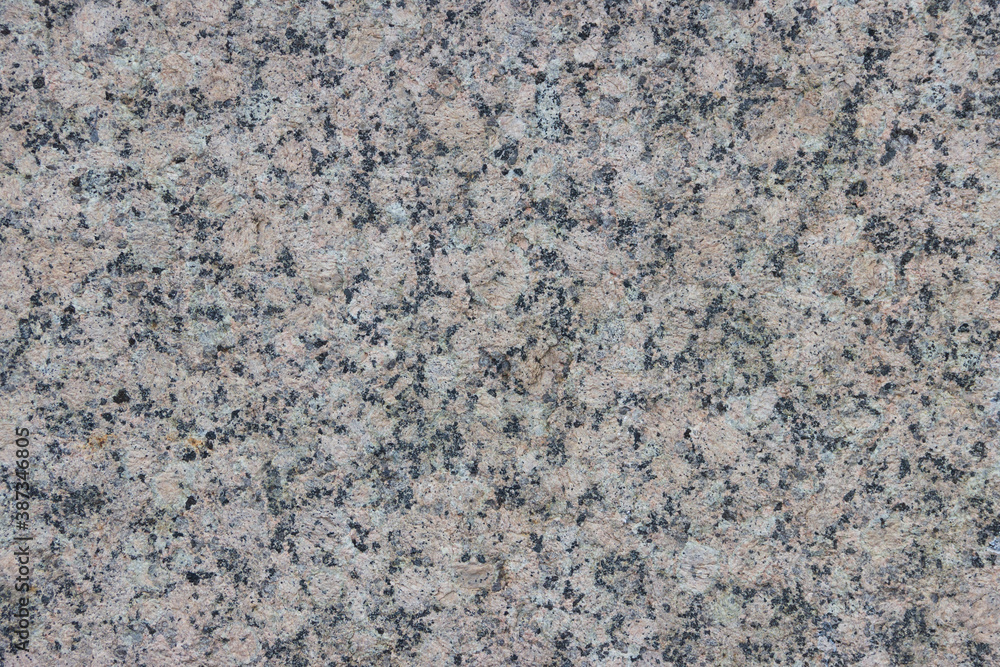 The texture of a variegated speckled polished marble slab. The texture of a variegated speckled polished marble slab.
