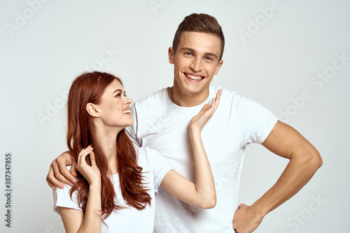 Portrait of man and woman family love emotions light background close-up cropped view