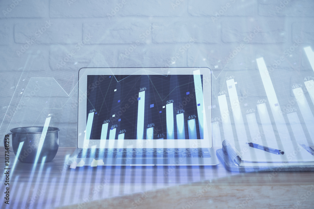 Stock market graph and table with computer background. Double exposure. Concept of financial analysis. Stock market graph and table with computer background. Double exposure. Concept of financial analysis.