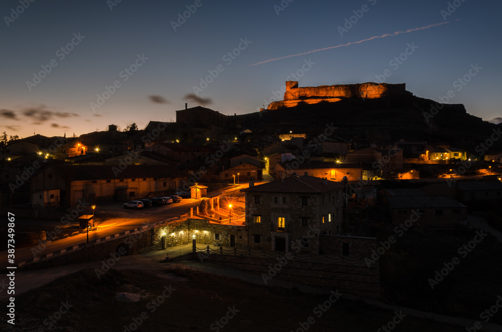 City landscape of the medieval city of Atienza at sunset with the castle on top of the hill, Guadalajara, Spain