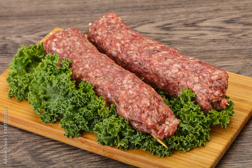 Raw minced beef kebab skewer