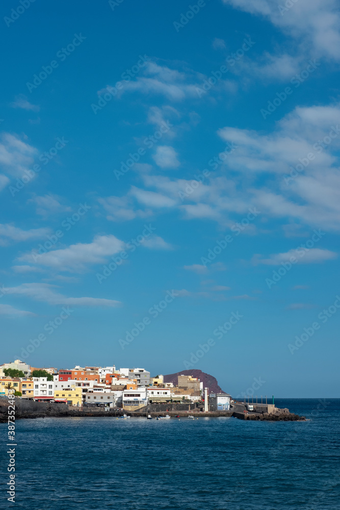 Los Abrigos with its colorful houses, the harbor and Montana Roja in the background, a picturesque village popular for pescatarian cuisine in the south of the island of Tenerife, Canary Islands, Spain
