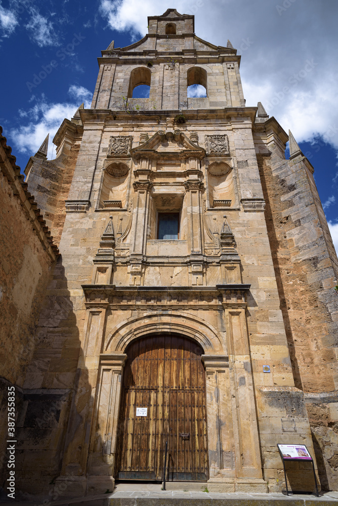 Facade of the Renaissance Church of the former convent of Santo Domingo or San Blas pointing to the sky in the medieval village of Cifuentes, Guadalajara, Spain