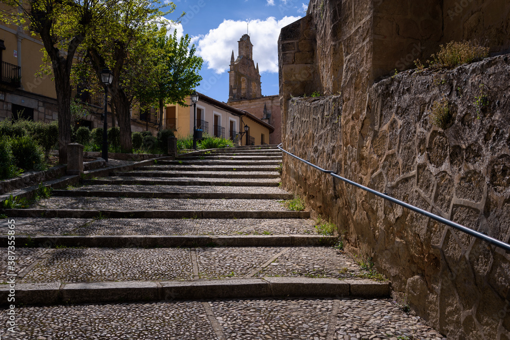 Cobbled staircase on the streets of Cifuentes with the church of Santo Domingo in the background, Guadalajara, Spain
