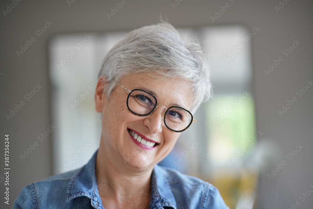 portrait of a beautiful smiling 50-year-old woman with white hair portrait of a beautiful smiling 50-year-old woman with white hair