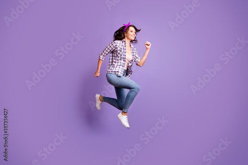 Profile photo portrait of cute pretty brown hair woman wear vintage checkered shirt jumping high isolated violet color background