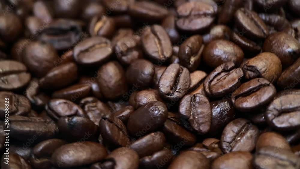 Coffee beans spinning around. Close up Coffee beans spinning around. Close up