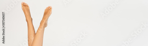 Woman with smooth legs in air isolated on white background  banner