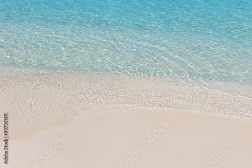 Crystal clear water and sand on beach of Ksamil in Albania  border between the Adriatic and Ionian seas