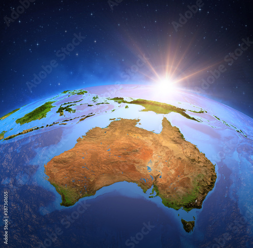 Surface of Planet Earth viewed from a satellite  focused on Australia  sun rising on the horizon. Physical map of the Australian continent - Elements of this image furnished by NASA.
