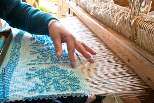 Carpet loom, weaver,  Laconi, Oristano, Sardinia, Italy photo