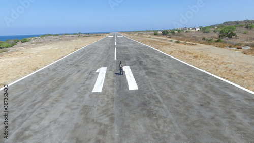 This is an airstrip on the island of Kisar close to the ocean photo