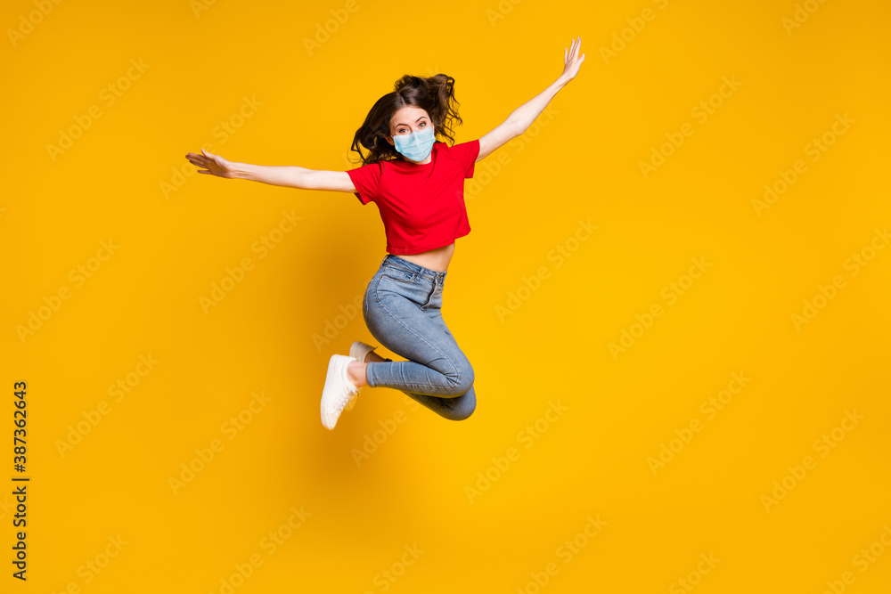 Full size photo of crazy cheerful girl jump hold hand wear mask isolated over vivid color background