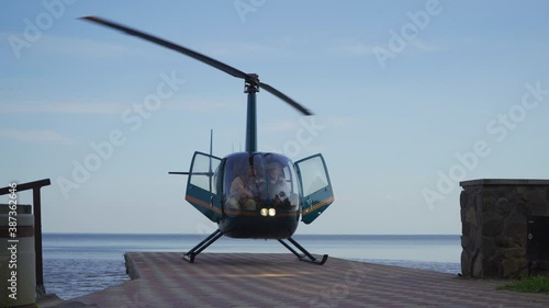 Open doors of the helicopter that landed on the pier. High quality.