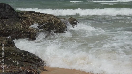 Slow motion footage of tropical sandy beach under bright sunny day