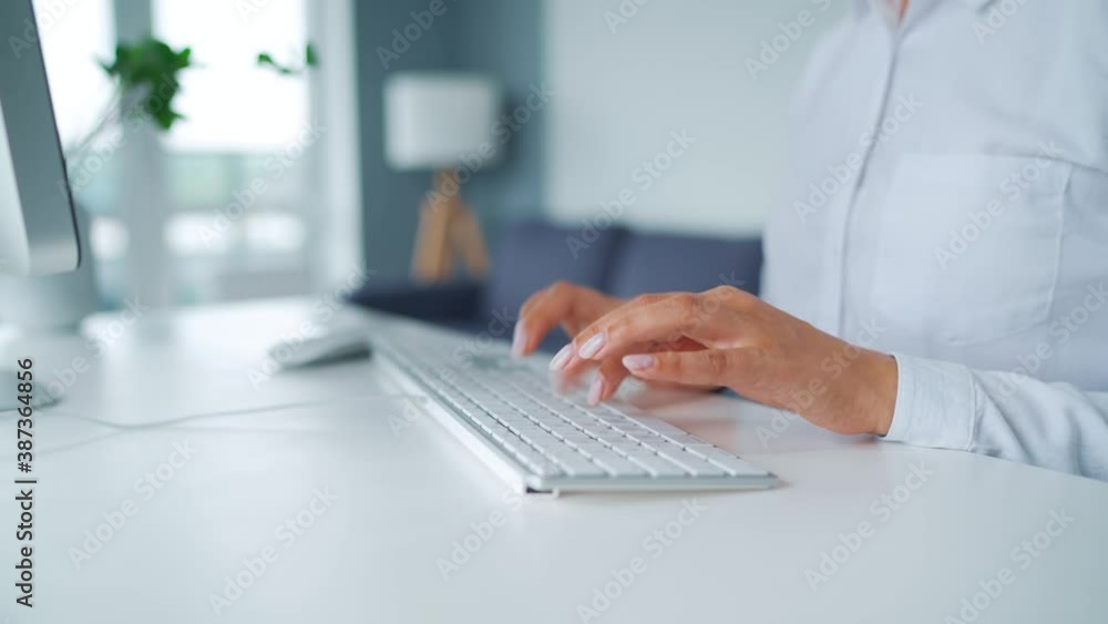 Woman typing on a computer keyboard. Concept of remote work. Woman typing on a computer keyboard. Concept of remote work.