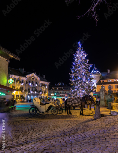 megeve christmas tree and car horses photo