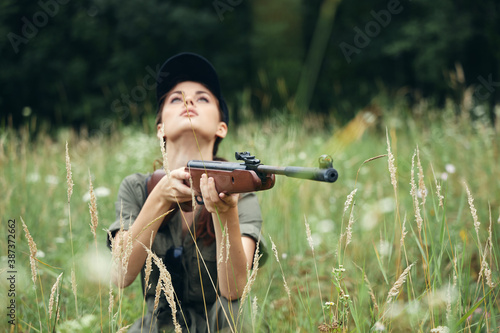 Military woman Weapon in hand upstairs hunting lifestyle fresh air