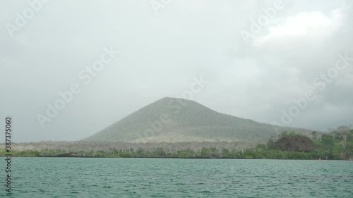 Volcanic Mountain in the Distance on Overcast Day at Sea on Floreana Island, Galapagos