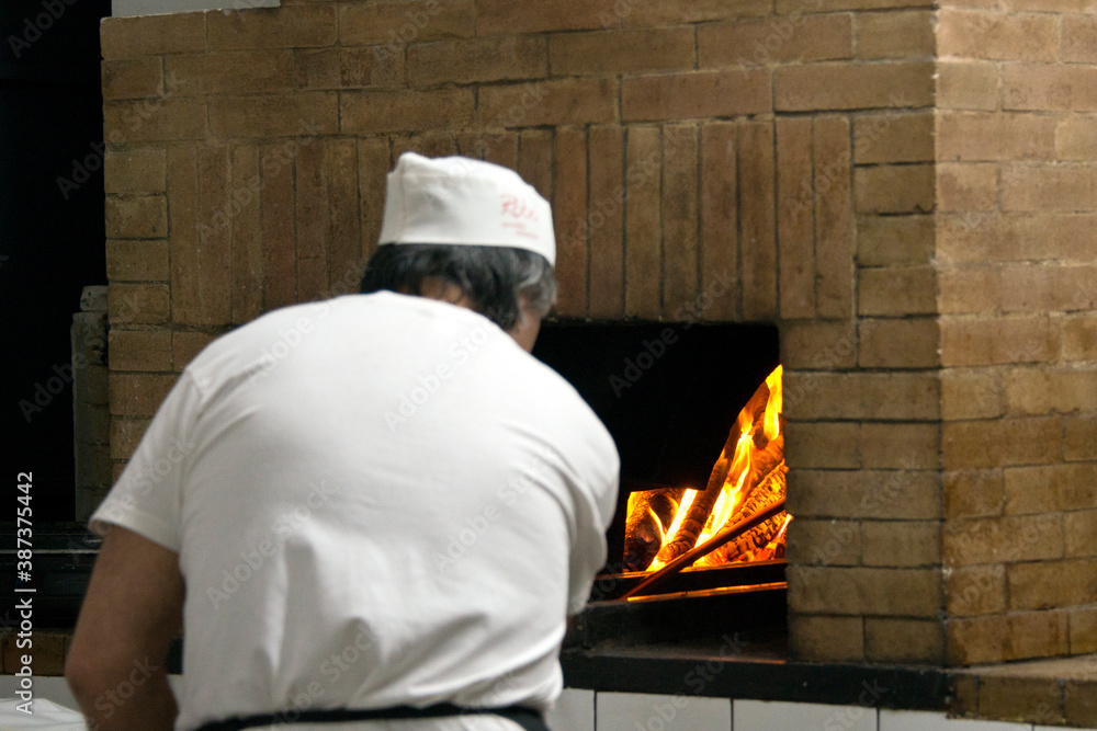 preparation of the famous fainè made with chickpea flour preparation of the famous fainè made with chickpea flour