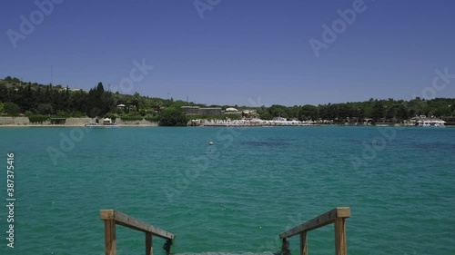 Aegean Sea, Cesme  Sea. View of the blue sea in front of the wooden ladder descending to the sea. photo