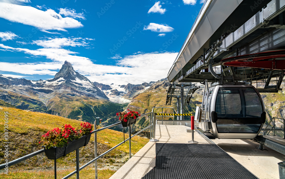 Cable car at Blauherd with the Matterhorn in the background. The Swiss Alps