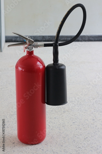 fire extinguisher container on wall in the building.